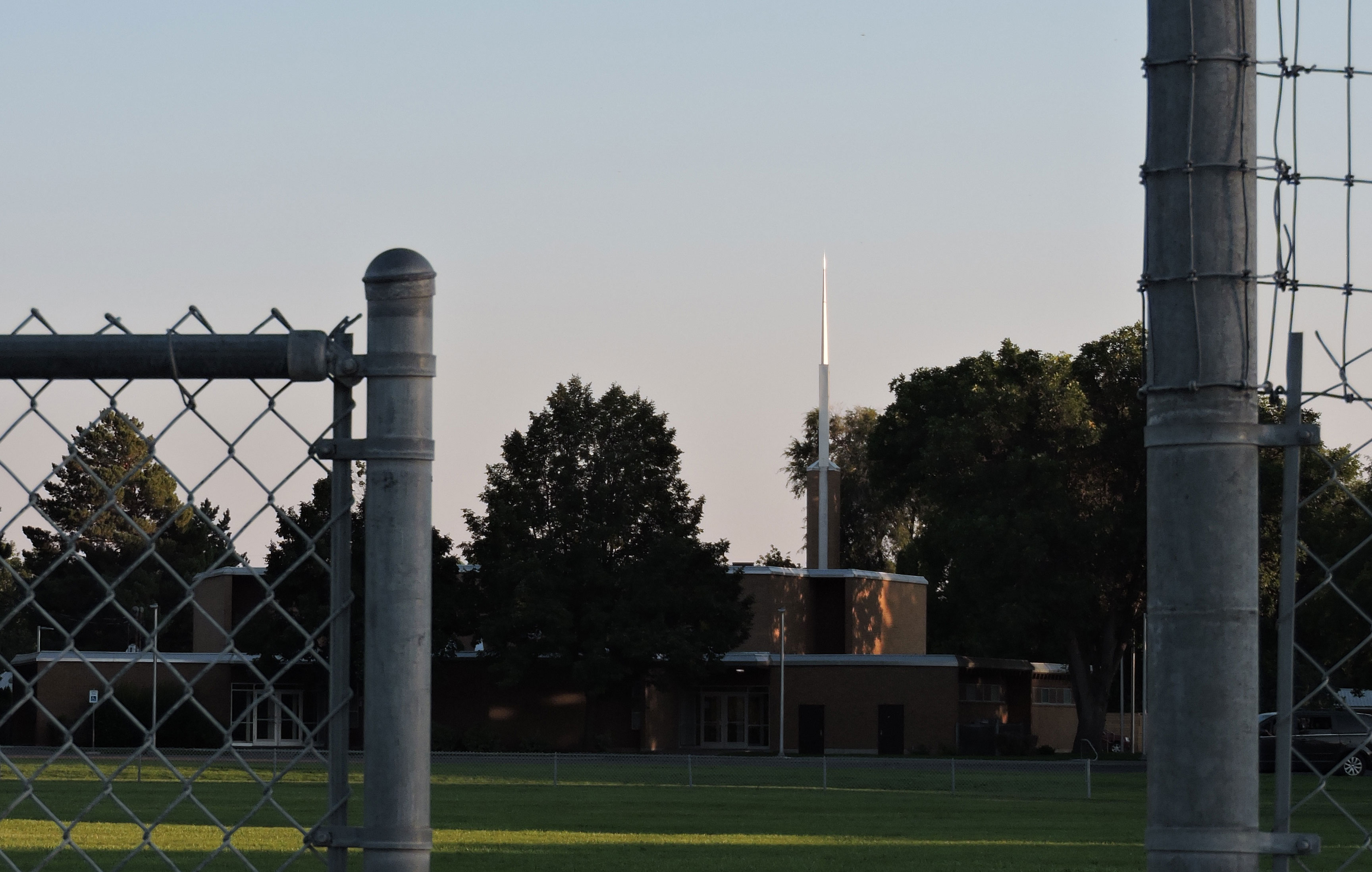 Church framed inside a fence